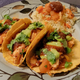 Pollo al pastor on homemade tortillas with Mexican butter rice and salsa